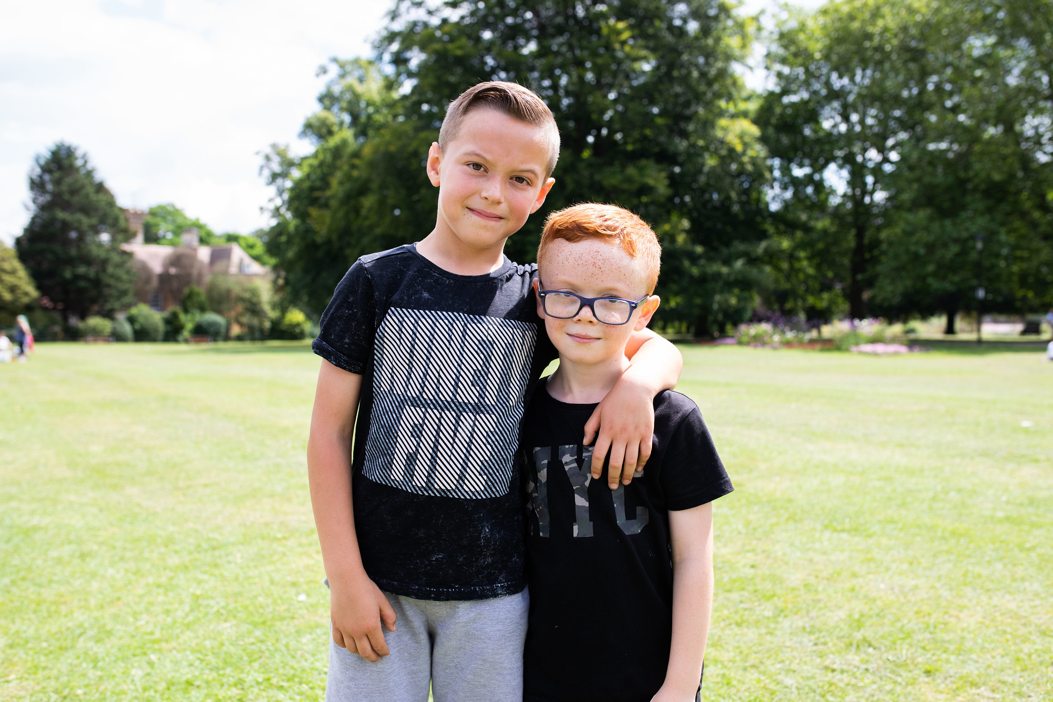 Two young boys Two young boys with their arms round each other