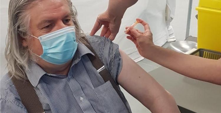 Robert receiving his covid vaccine