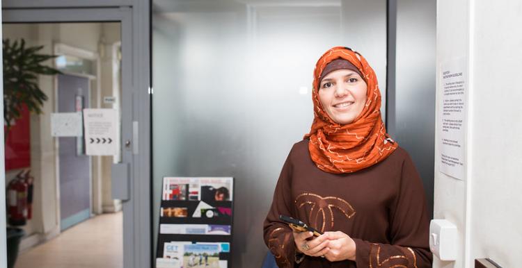 Image of female holding mobile phone