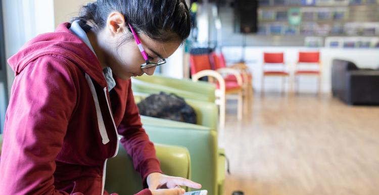 Young person using phone