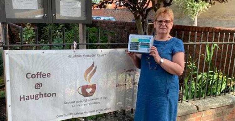 Image of Cathryn from Darlington Methodist Church stood holding suicide prevention tin