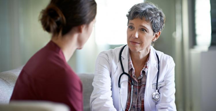 women talking to doctor
