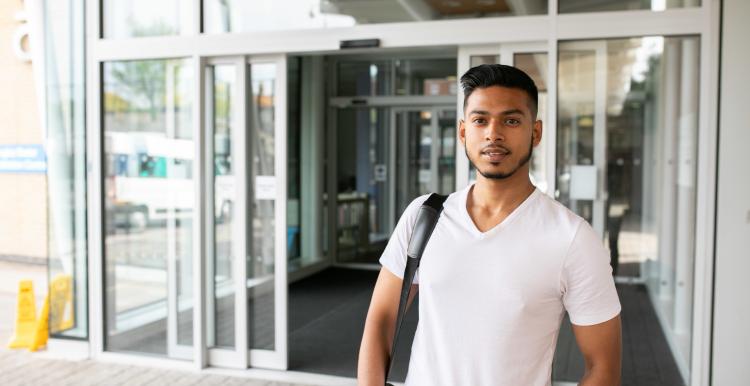 Young man outside hospital 