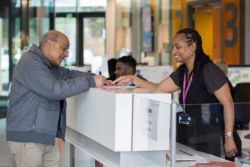 A man in a reception area