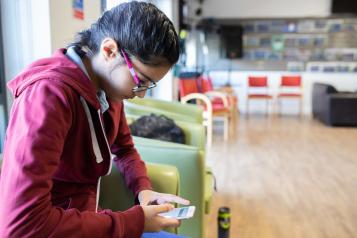 Young person using phone