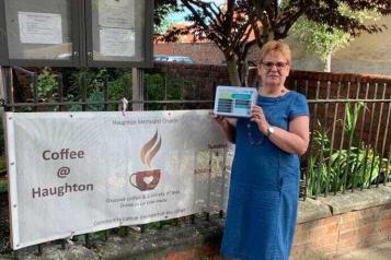 Image of Cathryn from Darlington Methodist Church stood holding suicide prevention tin