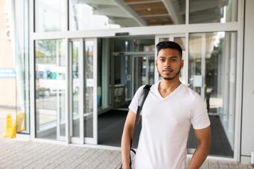 Young man outside hospital